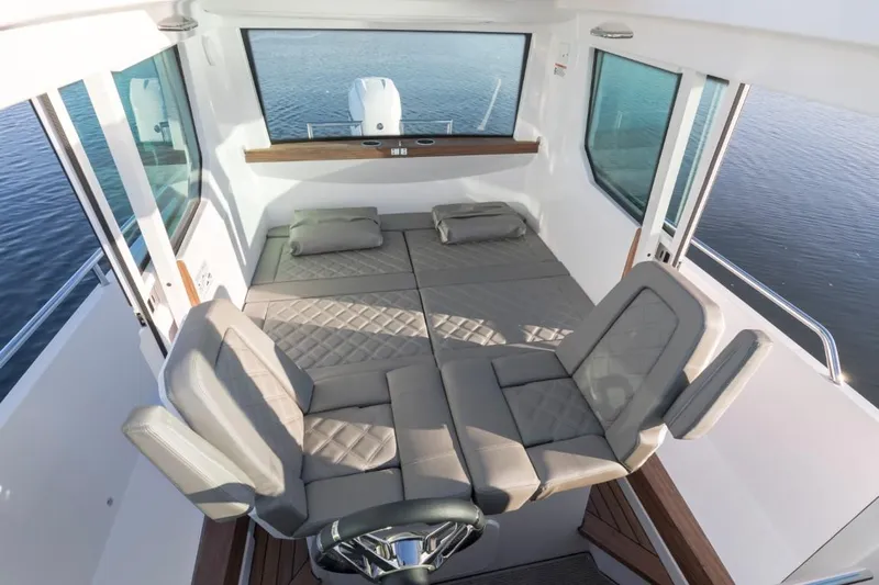  Yacht Photos Pics Interior of 2022 Axopar 28 CABIN with seating and lounging areas.