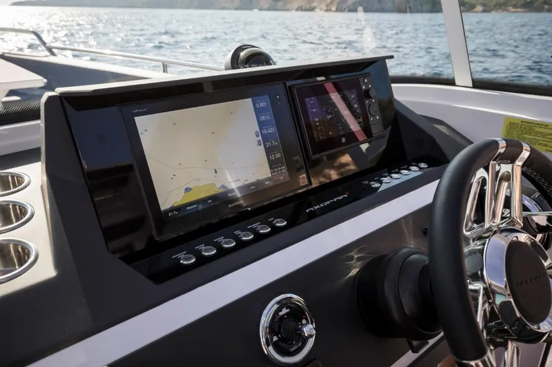  Yacht Photos Pics Axopar 28 CABIN 2022 helm with navigation system.