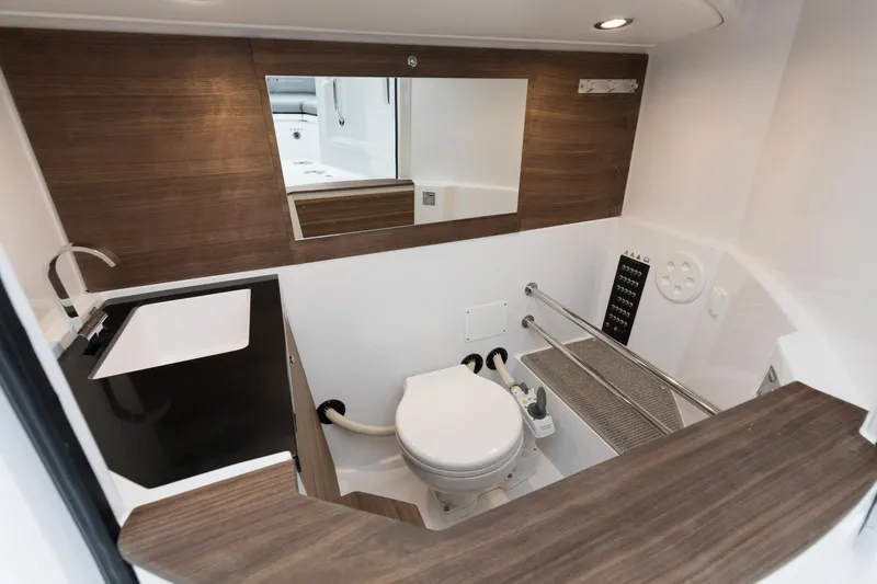  Yacht Photos Pics Interior of Axopar 28 CABIN 2022 featuring modern bathroom design.