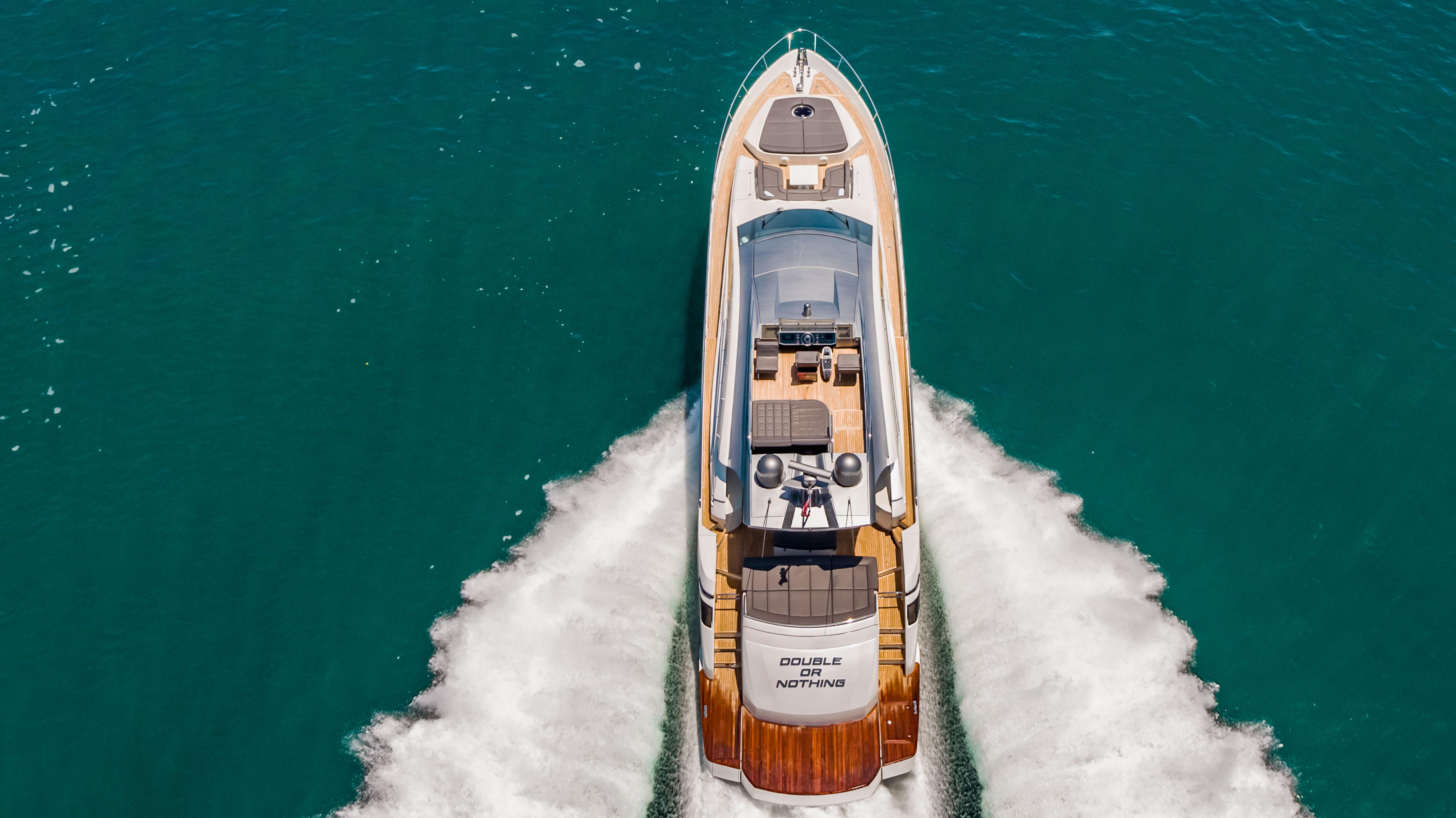 Aerial view of 2017 Pershing 82 VHP yacht cruising on blue water.