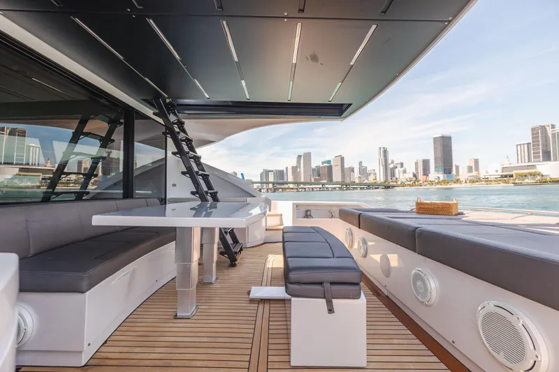 Double Or Nothing Yacht Photos Pics Luxurious deck of 2017 Pershing 82 VHP yacht with city skyline view.