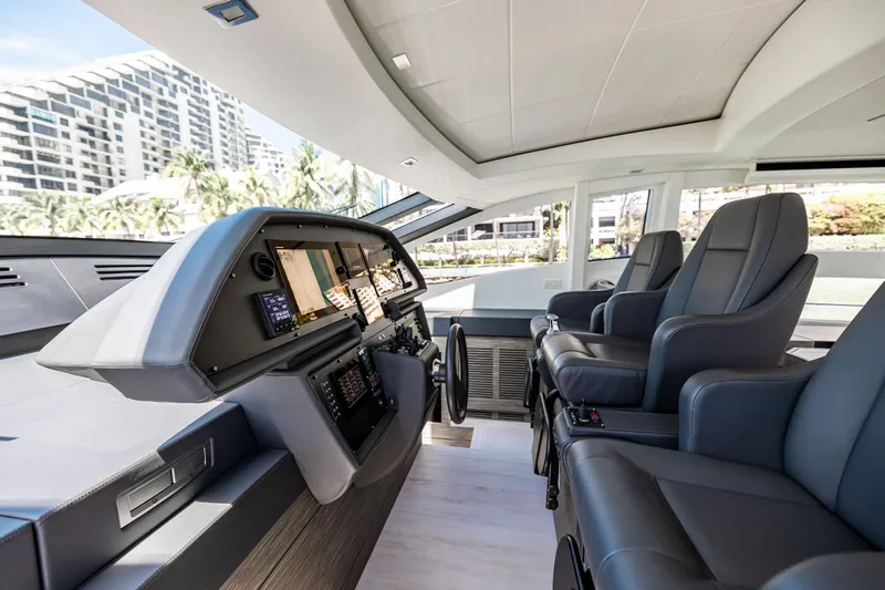 Double Or Nothing Yacht Photos Pics 2017 Pershing 82 VHP yacht cockpit with modern navigation systems and luxurious seating.