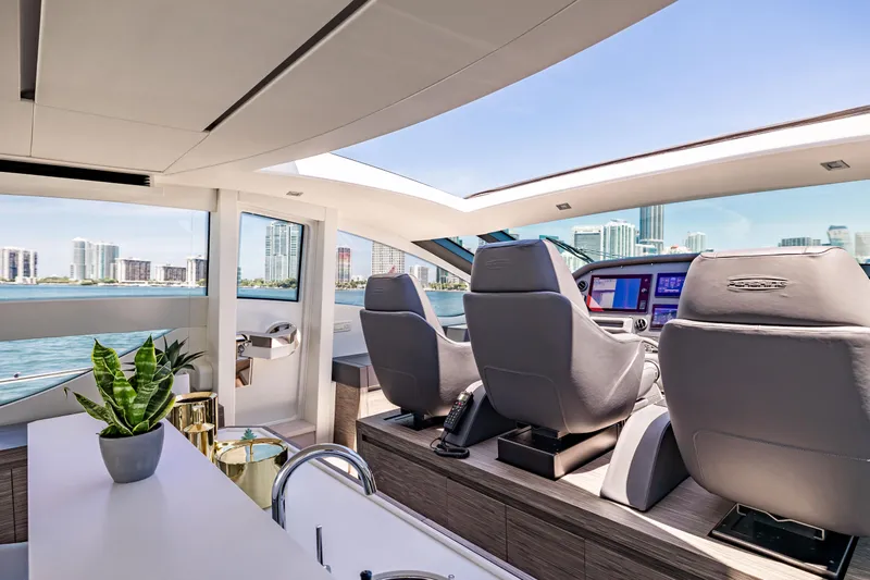 Double Or Nothing Yacht Photos Pics Interior of 2017 Pershing 82 VHP yacht with modern helm and city skyline view.