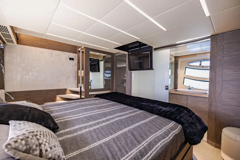 Double Or Nothing Yacht Photos Pics Luxurious bedroom interior of 2017 Pershing 82 VHP yacht with modern design and ample natural light.