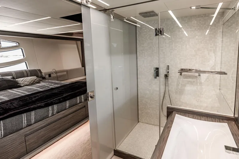 Double Or Nothing Yacht Photos Pics Luxurious bedroom and bathroom on a 2017 Pershing 82 VHP yacht.