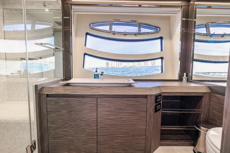 Double Or Nothing Yacht Photos Pics Luxurious bathroom on 2017 Pershing 82 VHP yacht with ocean view.