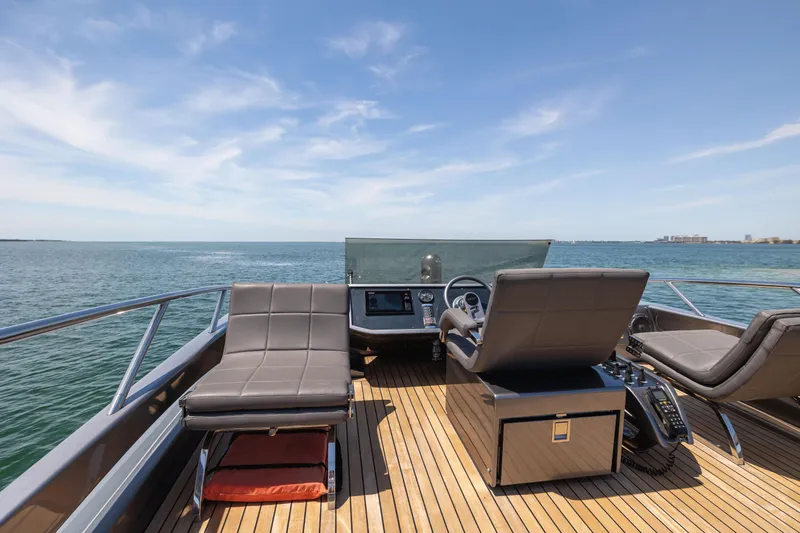 Double Or Nothing Yacht Photos Pics 2017 Pershing 82 VHP yacht deck with luxurious seating and ocean view.