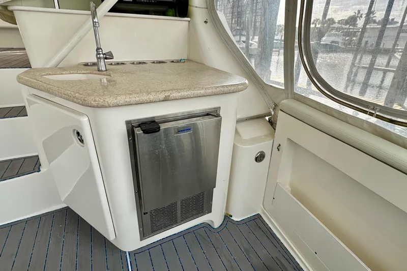  Yacht Photos Pics 2005 Silverton 43 Motor Yacht interior with kitchenette, sink, and mini fridge.