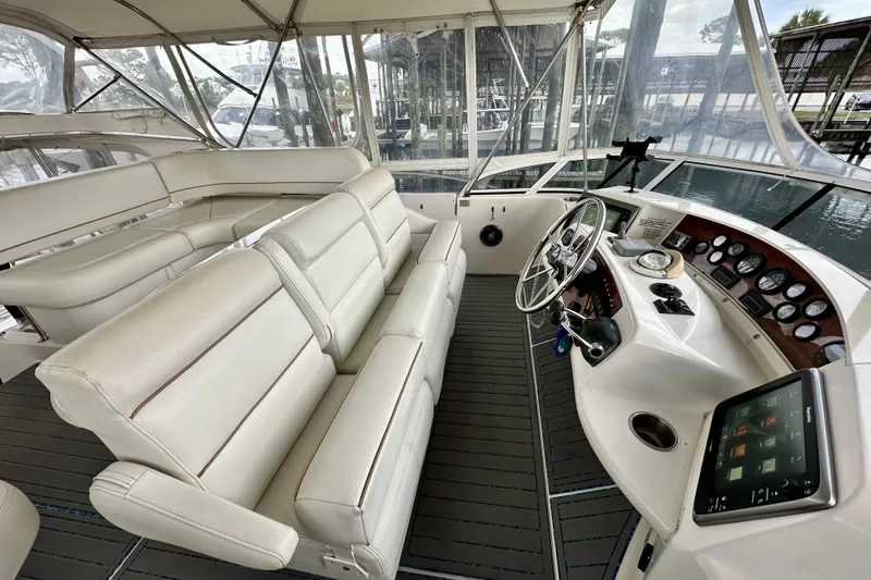 Yacht Photos Pics 2005 Silverton 43 Motor Yacht helm with luxurious seating and modern navigation instruments.