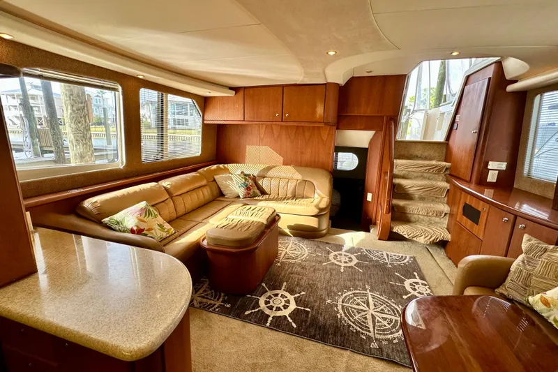  Yacht Photos Pics Luxurious interior of a 2005 Silverton 43 Motor Yacht with plush seating and elegant decor.