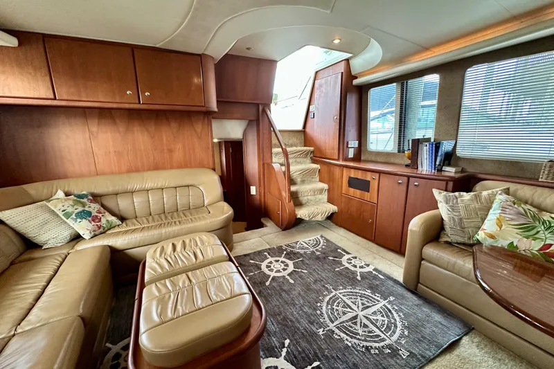  Yacht Photos Pics Luxurious interior of 2005 Silverton 43 Motor Yacht with plush seating and elegant wood finishes.