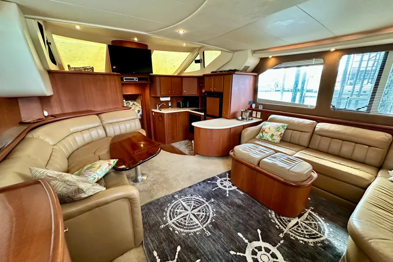  Yacht Photos Pics Luxurious interior of 2005 Silverton 43 Motor Yacht with plush seating and elegant decor.