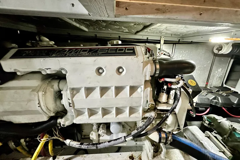  Yacht Photos Pics Engine room of a 2005 Silverton 43 Motor Yacht, showcasing high-performance machinery.