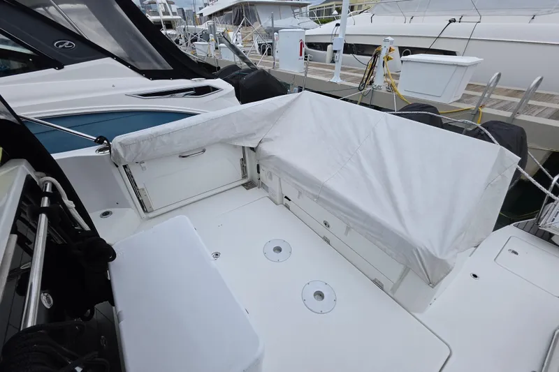  Yacht Photos Pics 2022 Jeanneau Leader 10.5 WA Series 2 boat deck with covered seating area.