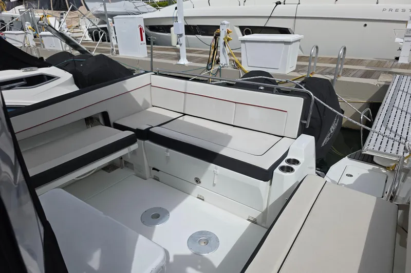  Yacht Photos Pics 2022 Jeanneau Leader 10.5 WA Series 2 boat interior with seating and cup holders.