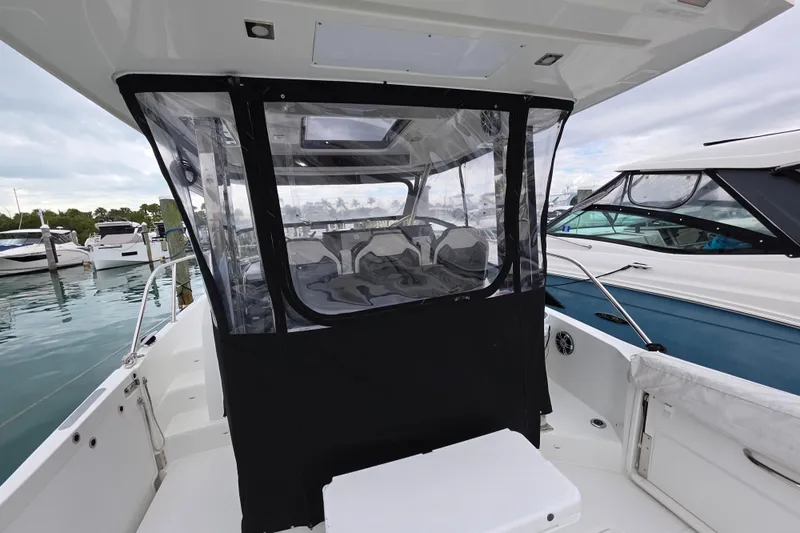  Yacht Photos Pics 2022 Jeanneau Leader 10.5 WA Series 2 boat with enclosed cockpit at marina.