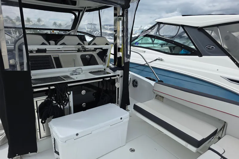  Yacht Photos Pics 2022 Jeanneau Leader 10.5 WA Series 2 boat interior with seating and kitchenette.