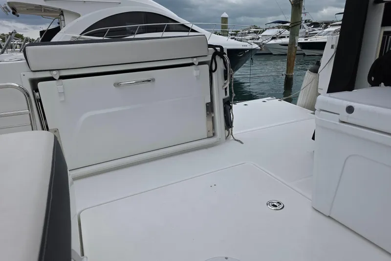  Yacht Photos Pics 2022 Jeanneau Leader 10.5 WA Series 2 boat deck with seating and storage.