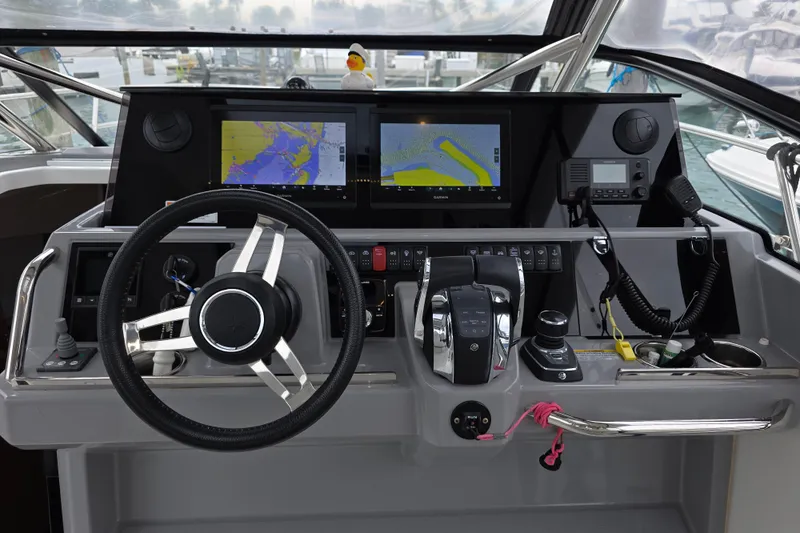  Yacht Photos Pics Cockpit of 2022 Jeanneau Leader 10.5 WA Series 2 with navigation screens and controls.