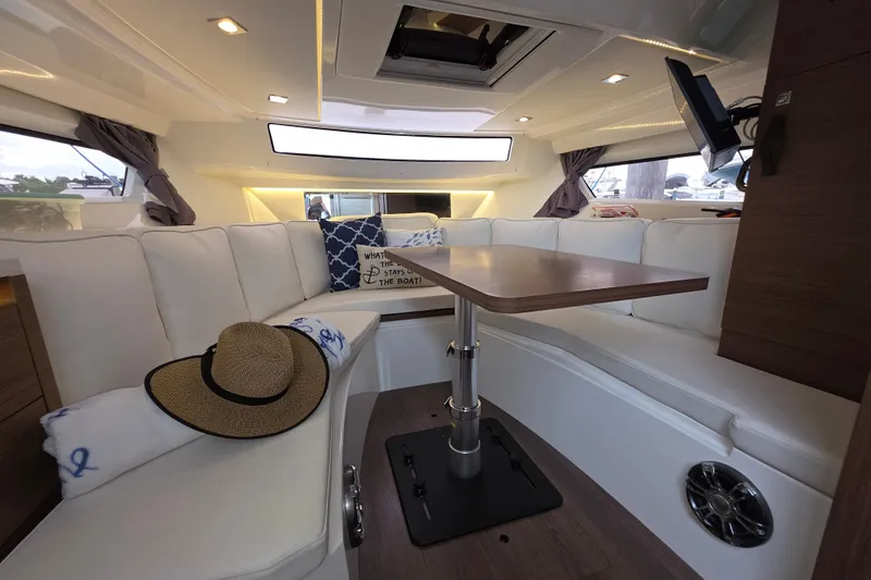  Yacht Photos Pics Luxurious interior of 2022 Jeanneau Leader 10.5 WA Series 2 boat with elegant seating.