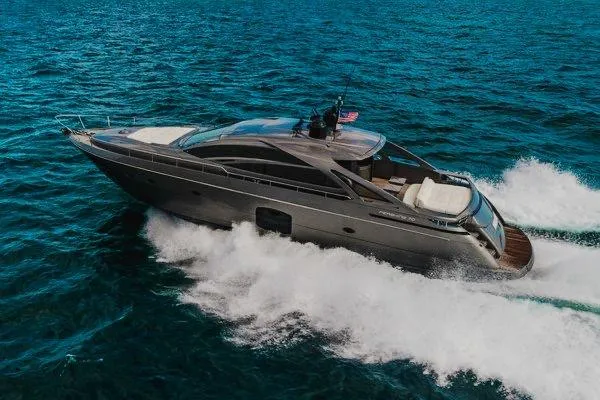 Andiamo Yacht Photos Pics 2015 Pershing 70 yacht cruising on open sea, showcasing sleek design and powerful performance.