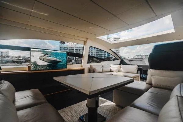 Andiamo Yacht Photos Pics Luxurious interior of a 2015 Pershing 70 yacht with modern seating and large windows.