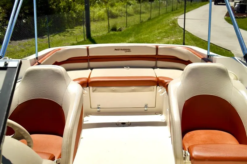  Yacht Photos Pics Interior of a 2001 Stingray 240 LS boat with tan and brown seating.