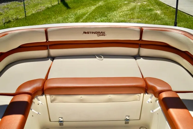  Yacht Photos Pics 2001 Stingray 240 LS boat interior with tan and brown seating.