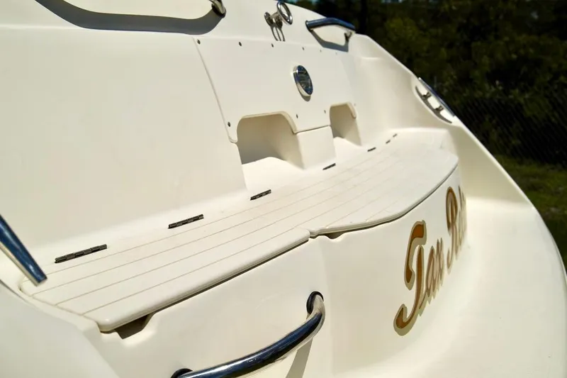  Yacht Photos Pics 2001 Stingray 240 LS boat stern with swim platform and chrome details.