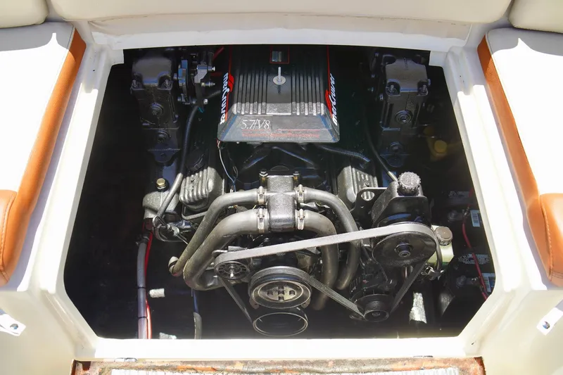  Yacht Photos Pics Engine compartment of a 2001 Stingray 240 LS boat, featuring a MerCruiser 5.7L V8 engine.