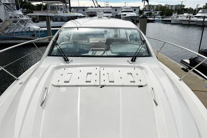 Yolo Or 2 Yacht Photos Pics 2014 Pursuit SC 365i Sport Coupe docked at marina, showcasing sleek design and spacious deck.