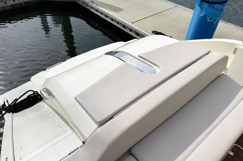 Yolo Or 2 Yacht Photos Pics 2014 Pursuit SC 365i Sport Coupe at dock, featuring sleek design and cushioned seating.