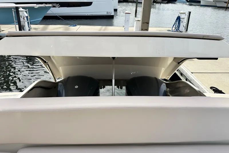 Yolo Or 2 Yacht Photos Pics 2014 Pursuit SC 365i Sport Coupe engine compartment at marina dock.