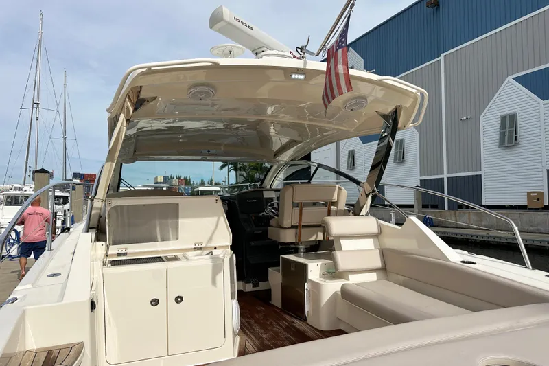 Yolo Or 2 Yacht Photos Pics 2014 Pursuit SC 365i Sport Coupe yacht docked at marina, featuring spacious seating and helm.