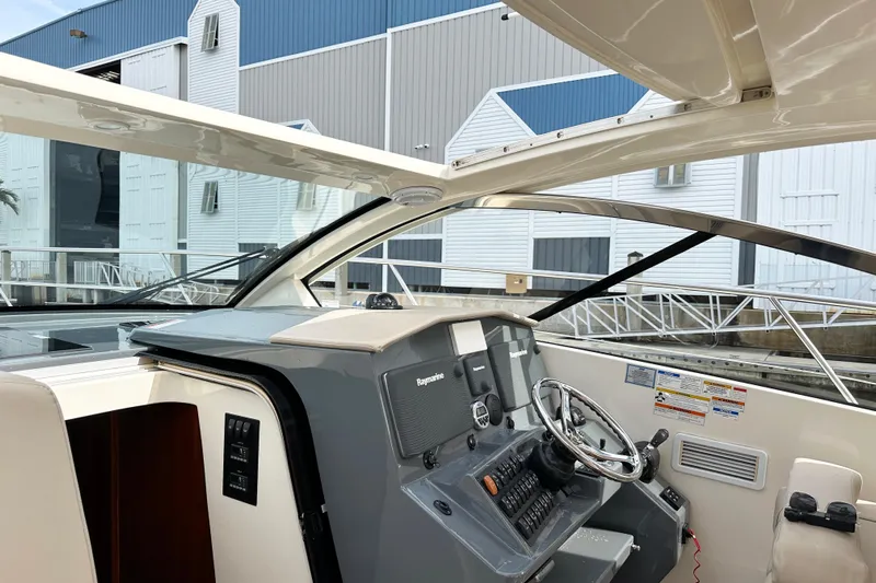 Yolo Or 2 Yacht Photos Pics 2014 Pursuit SC 365i Sport Coupe helm with modern controls and sleek design.