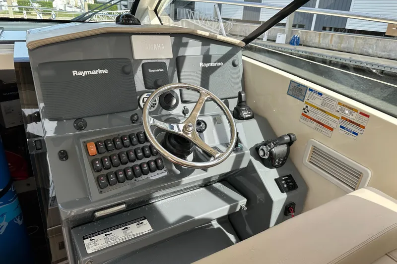 Yolo Or 2 Yacht Photos Pics 2014 Pursuit SC 365i Sport Coupe helm with Raymarine electronics and Yamaha controls.