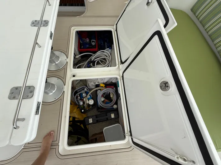 Two Fish Yacht Photos Pics Open storage compartments on Antares 44GS yacht, showcasing organized equipment and supplies.