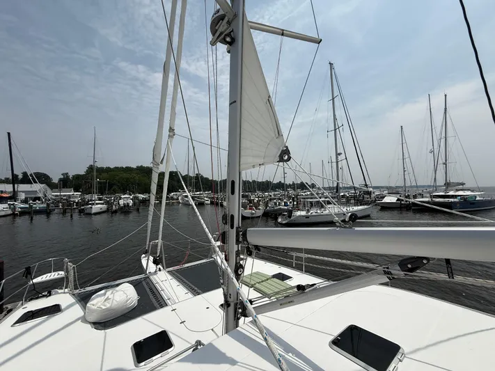 Two Fish Yacht Photos Pics Sailing yacht Antares 44GS (2021) docked at marina with clear sky.
