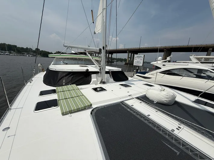 Two Fish Yacht Photos Pics 2021 Antares 44GS yacht on water, featuring spacious deck and modern design.