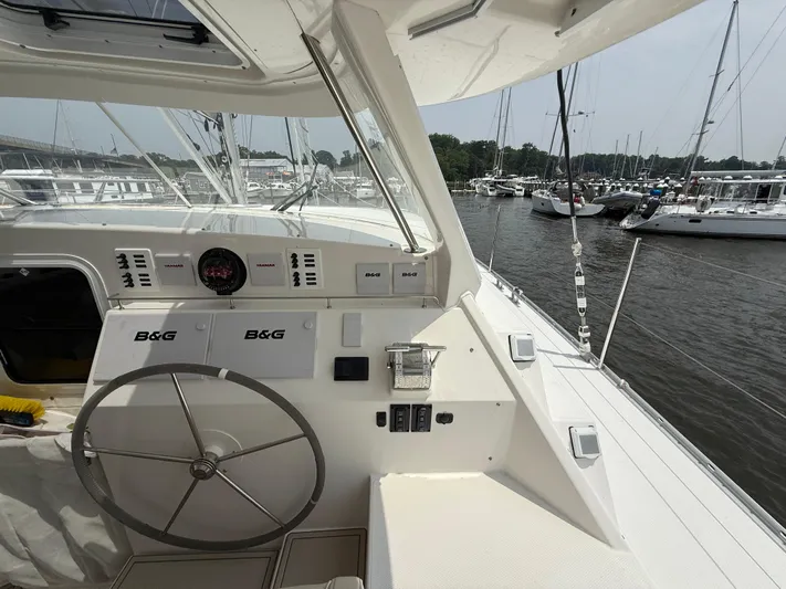 Two Fish Yacht Photos Pics Helm of 2021 Antares 44GS yacht with B&G navigation, docked in marina.