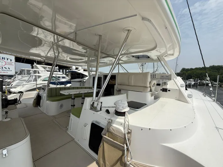 Two Fish Yacht Photos Pics 2021 Antares 44GS yacht interior with seating and helm, docked at marina.