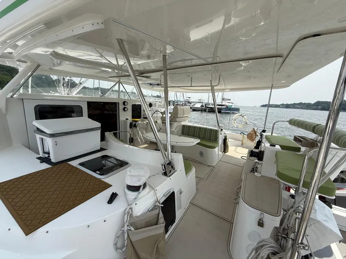 Two Fish Yacht Photos Pics Spacious deck of 2021 Antares 44GS yacht with seating and ocean view.