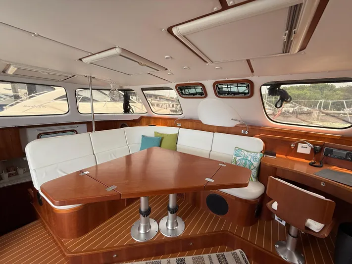 Two Fish Yacht Photos Pics Luxurious interior of 2021 Antares 44GS yacht with elegant seating and wooden finishes.