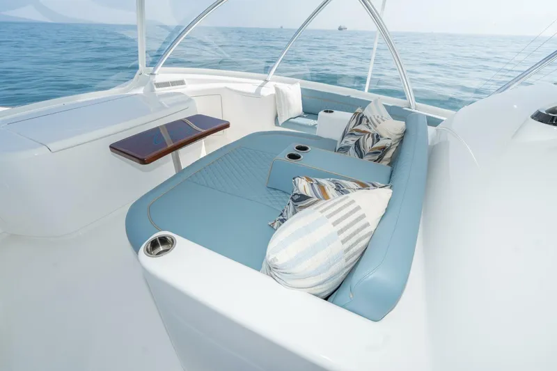 Zatara Yacht Photos Pics Luxurious seating area on 2025 Viking 90 Convertible yacht with ocean view.