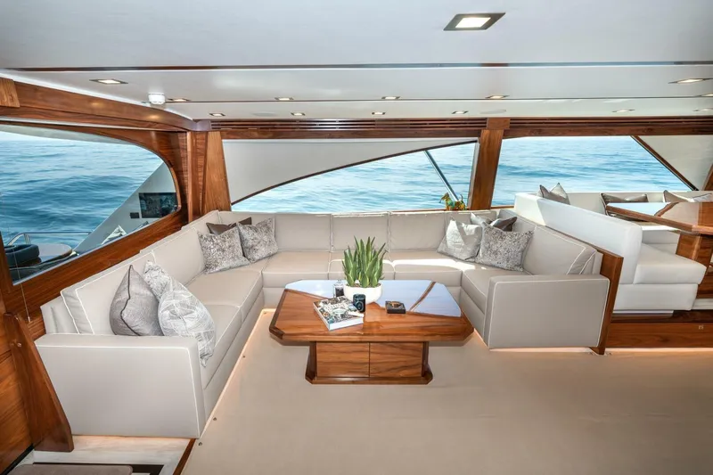 Zatara Yacht Photos Pics Luxurious interior of 2025 Viking 90 Convertible yacht with elegant seating and ocean view.