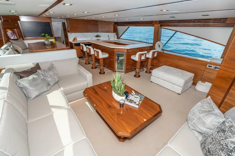 Zatara Yacht Photos Pics Luxurious interior of 2025 Viking 90 Convertible yacht with elegant seating and ocean view.