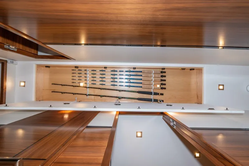 Zatara Yacht Photos Pics 2025 Viking 90 Convertible yacht interior with fishing rod storage.