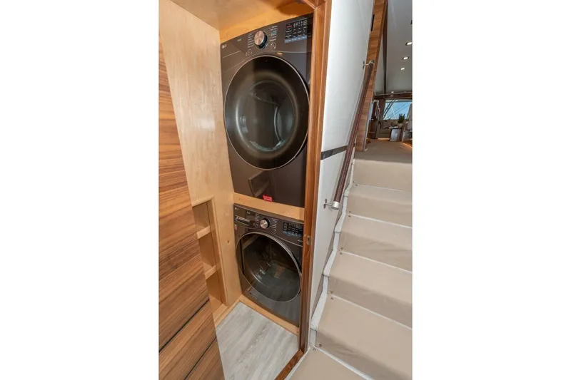 Zatara Yacht Photos Pics Stacked washer and dryer in 2025 Viking 90 Convertible yacht interior.