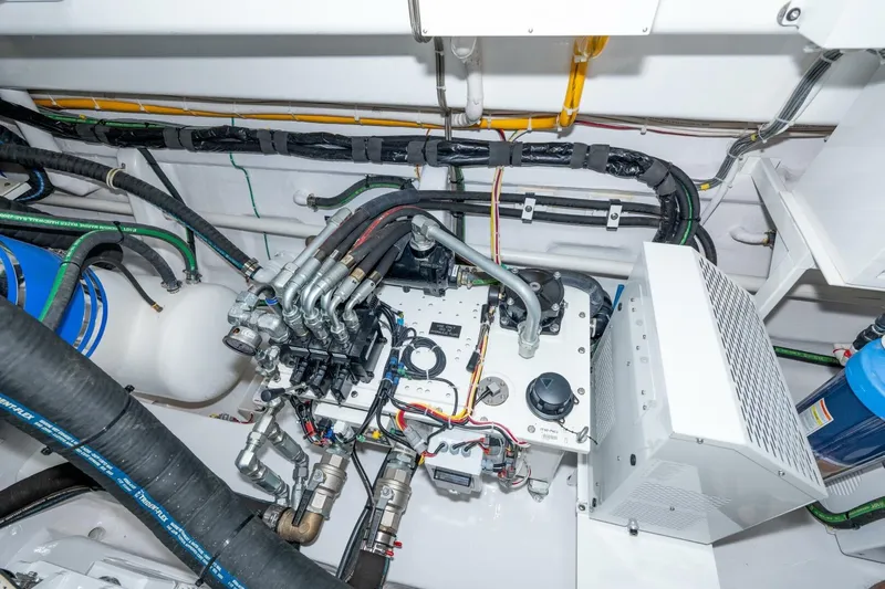 Zatara Yacht Photos Pics Engine room of 2025 Viking 90 Convertible yacht, showcasing complex machinery and wiring.