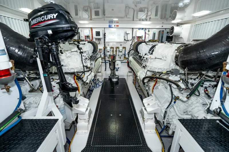 Zatara Yacht Photos Pics Engine room of 2025 Viking 90 Convertible yacht, featuring advanced machinery and Mercury outboard motor.